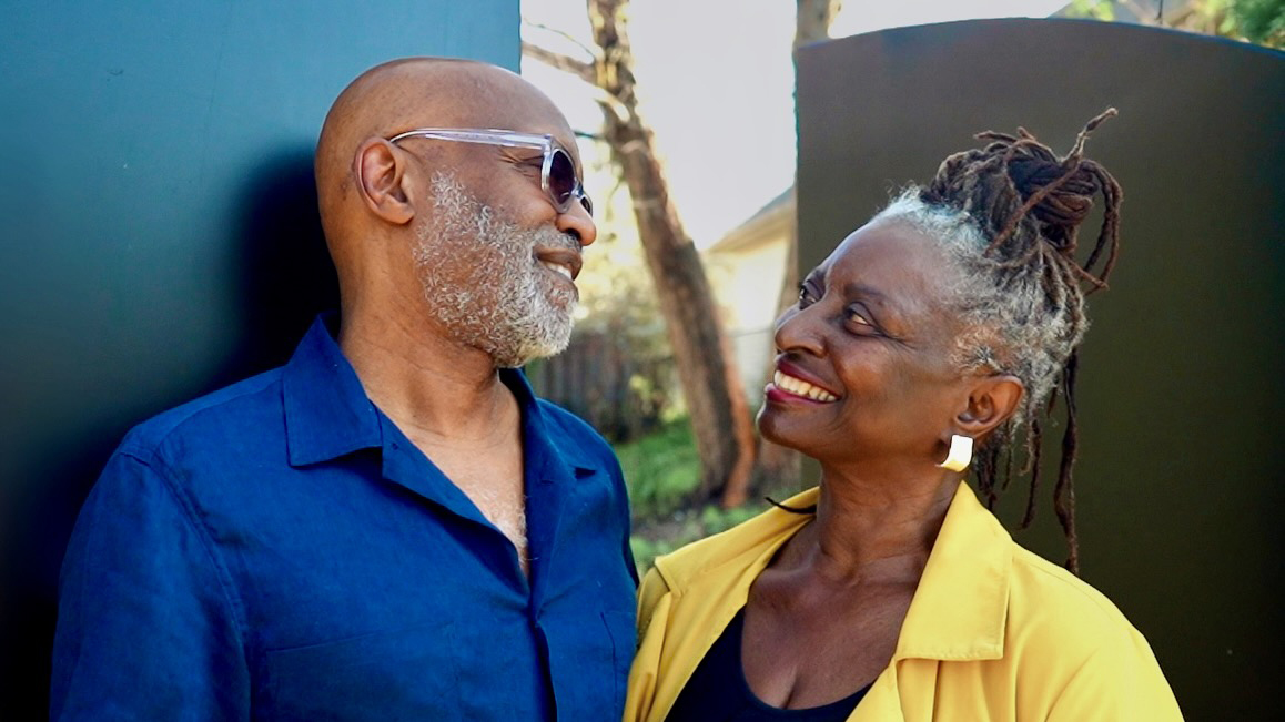 Visual Artist Seitu Ken Jones and Poet Soyini Vinelle Guyton pose before their interview for Art + Medicine: Healthy Aging on what matters to them when aging and how they are going to leave a legacy.